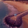 VIDEO YouTube: Australia, si tuffa in mare vestito per salvare il suo drone2