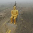 Villagers and businessmen build a giant Chairman Mao statue in China.