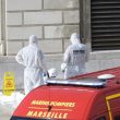 Investigative police officers work at a body outside Marseille 's main train station Sunday, Oct. 1, 2017 in Marseille, southern France. A man with a knife attacked people at the main train station in the southeastern French city of Marseille on Sunday, killing two women before soldiers fatally shot the assailant, officials said. (ANSA/AP Photo/Claude Paris) [CopyrightNotice: Copyright 2017 The Associated Press. All rights reserved.]