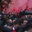 Liverpool supporters light red flares outside the stadium before the Champions League semifinal, first leg, soccer match between Liverpool and AS Roma at Anfield Stadium, Liverpool, England, Tuesday, April 24, 2018. (ANSA/AP Photo/Dave Thompson) [CopyrightNotice: Copyright 2018 The Associated Press. All rights reserved.]